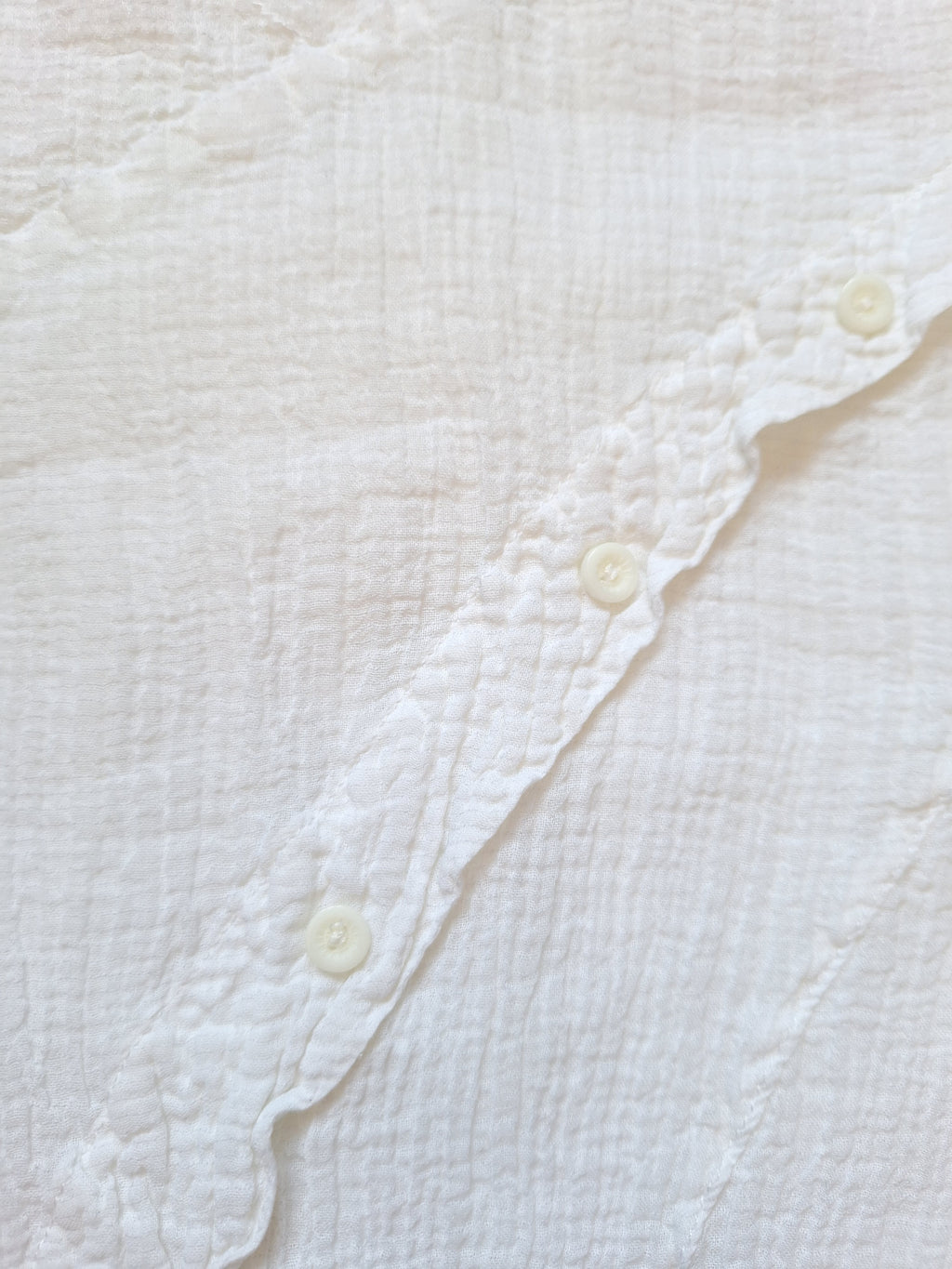 White cotton gauze top with open back and diagonal button trim — L
