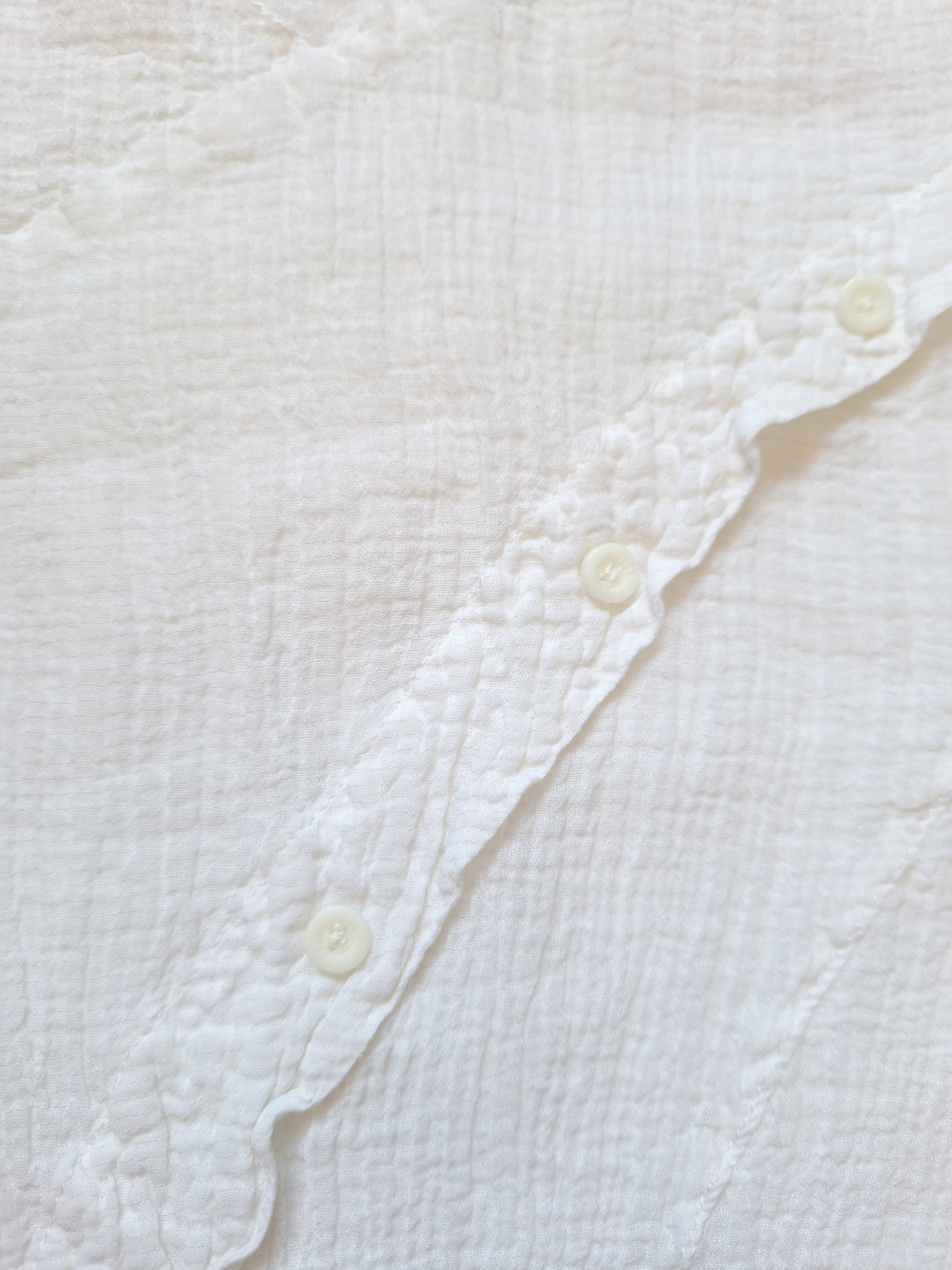 White cotton gauze top with open back and diagonal button trim — L
